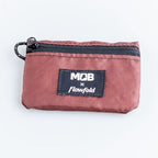 Red zippered pouch with Flowfold logo on a white background